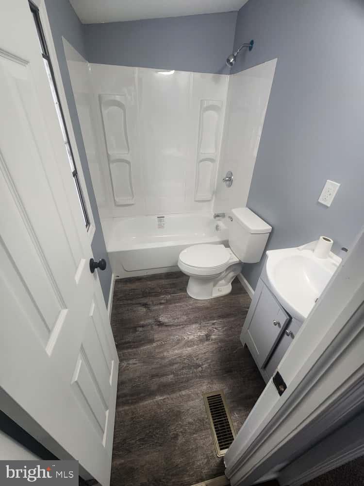 260 Marshall Mill Road, Unit 148 Franklinville, NJ 08322 - Photo 4 of 14 a bathroom with a toilet and a shower