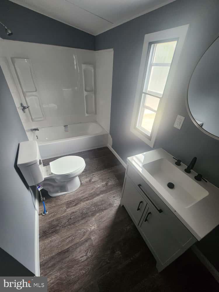 260 Marshall Mill Road, Unit 148 Franklinville, NJ 08322 - Photo 10 of 14 a bathroom with a sink and a mirror