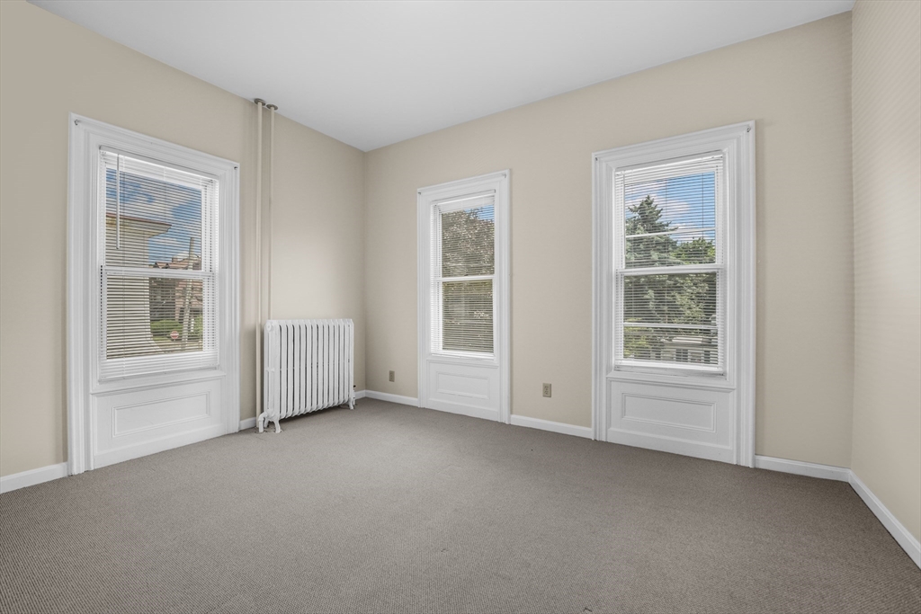 216 Grove Street Fall River, MA 02720 - Photo 11 of 26 an empty room with windows