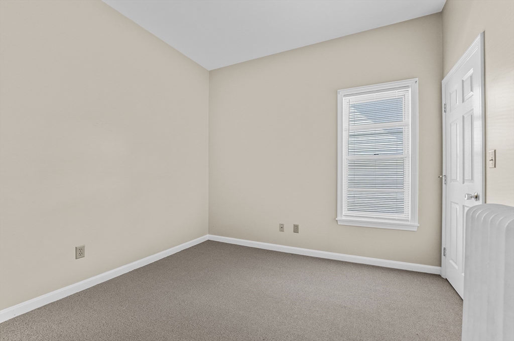 216 Grove Street Fall River, MA 02720 - Photo 13 of 26 an empty room with a window