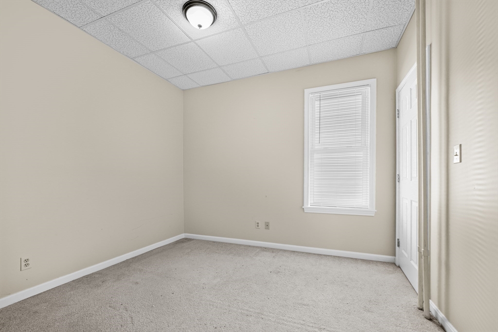 216 Grove Street Fall River, MA 02720 - Photo 14 of 26 an empty room with a window