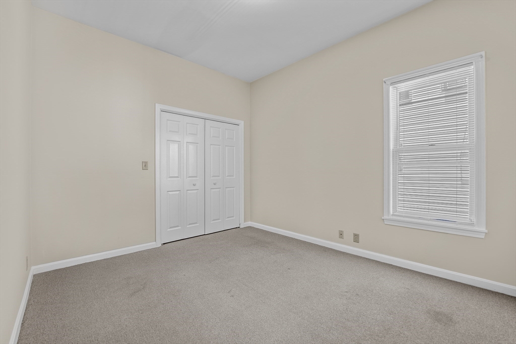 216 Grove Street Fall River, MA 02720 - Photo 20 of 26 an empty room with a window