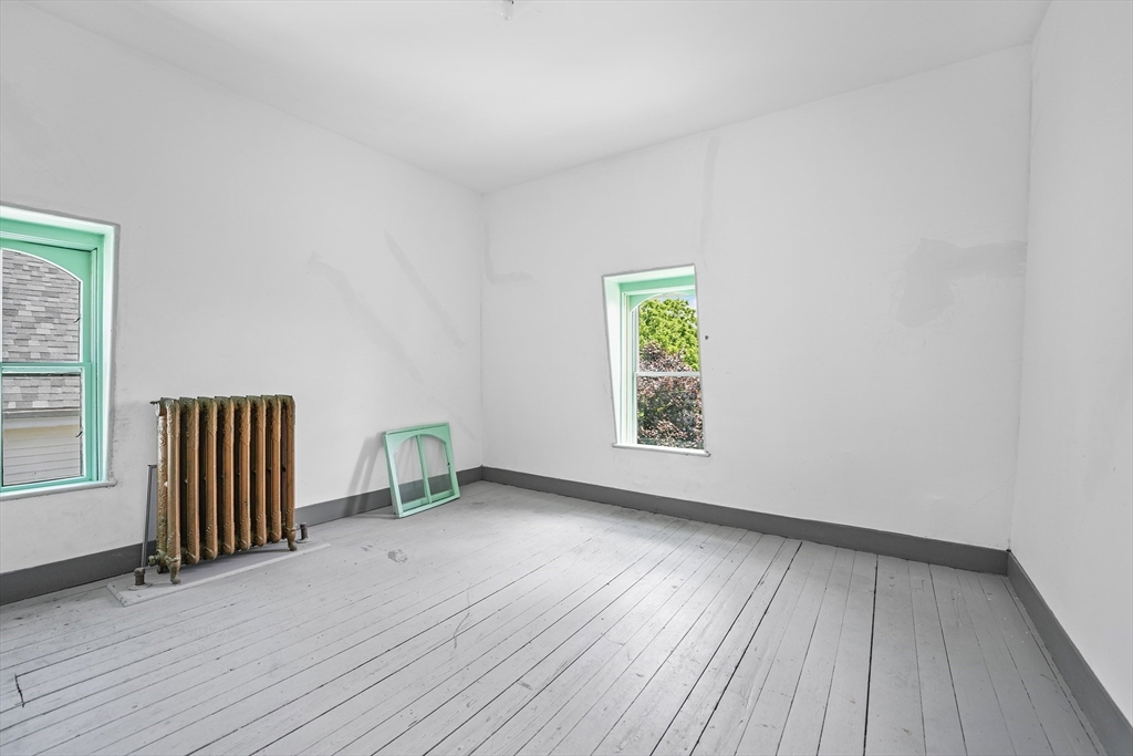 216 Grove Street Fall River, MA 02720 - Photo 23 of 26 an empty room with windows