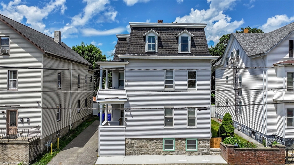 216 Grove Street Fall River, MA 02720 - Photo 3 of 26 a view of a house with many windows