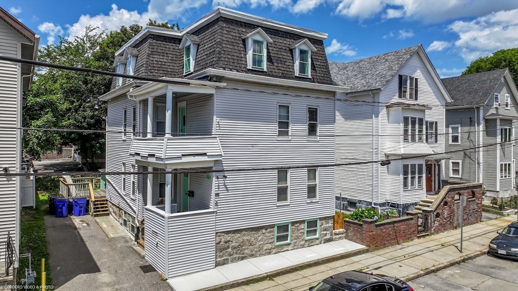 216 Grove Street Fall River, MA 02720 - Photo 4 of 26 a front view of a house with balcony