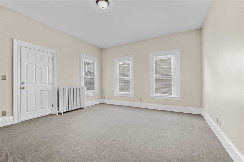 216 Grove Street Fall River, MA 02720 - Photo 10 of 26 an empty room with windows
