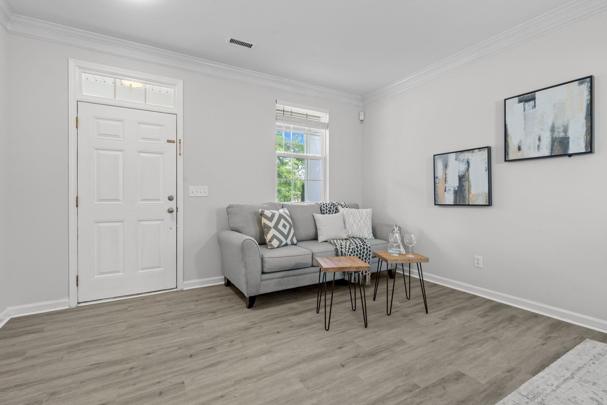 532 Emerald Downs Road Cary, NC 27519 - Photo 16 of 51 a living room with furniture and a wooden floor