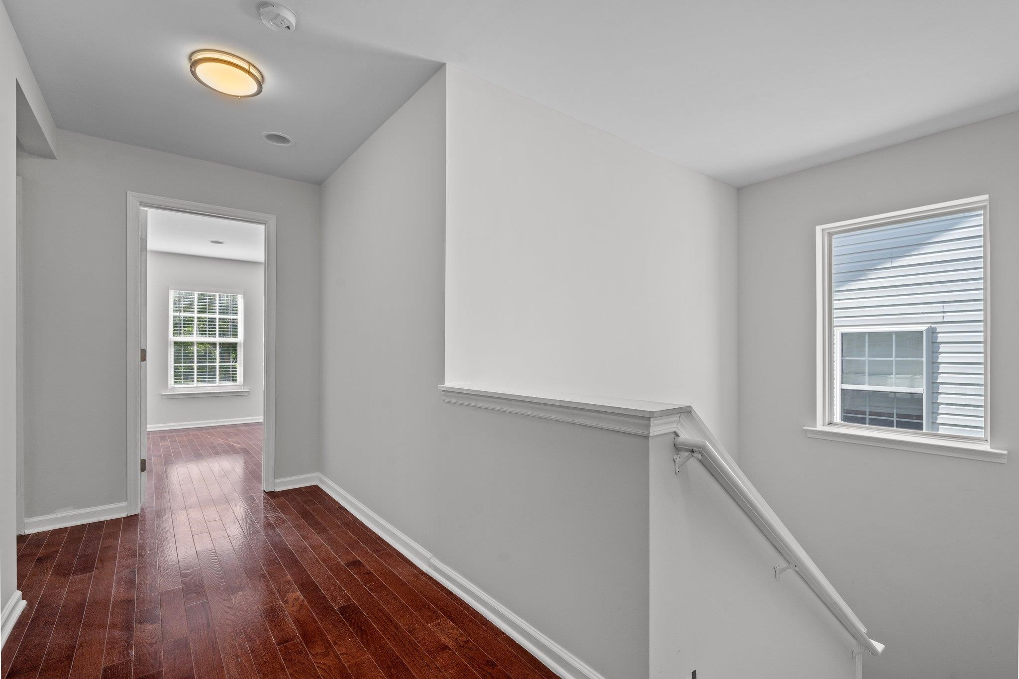 532 Emerald Downs Road Cary, NC 27519 - Photo 28 of 51 a view of hallway with window and wooden floor