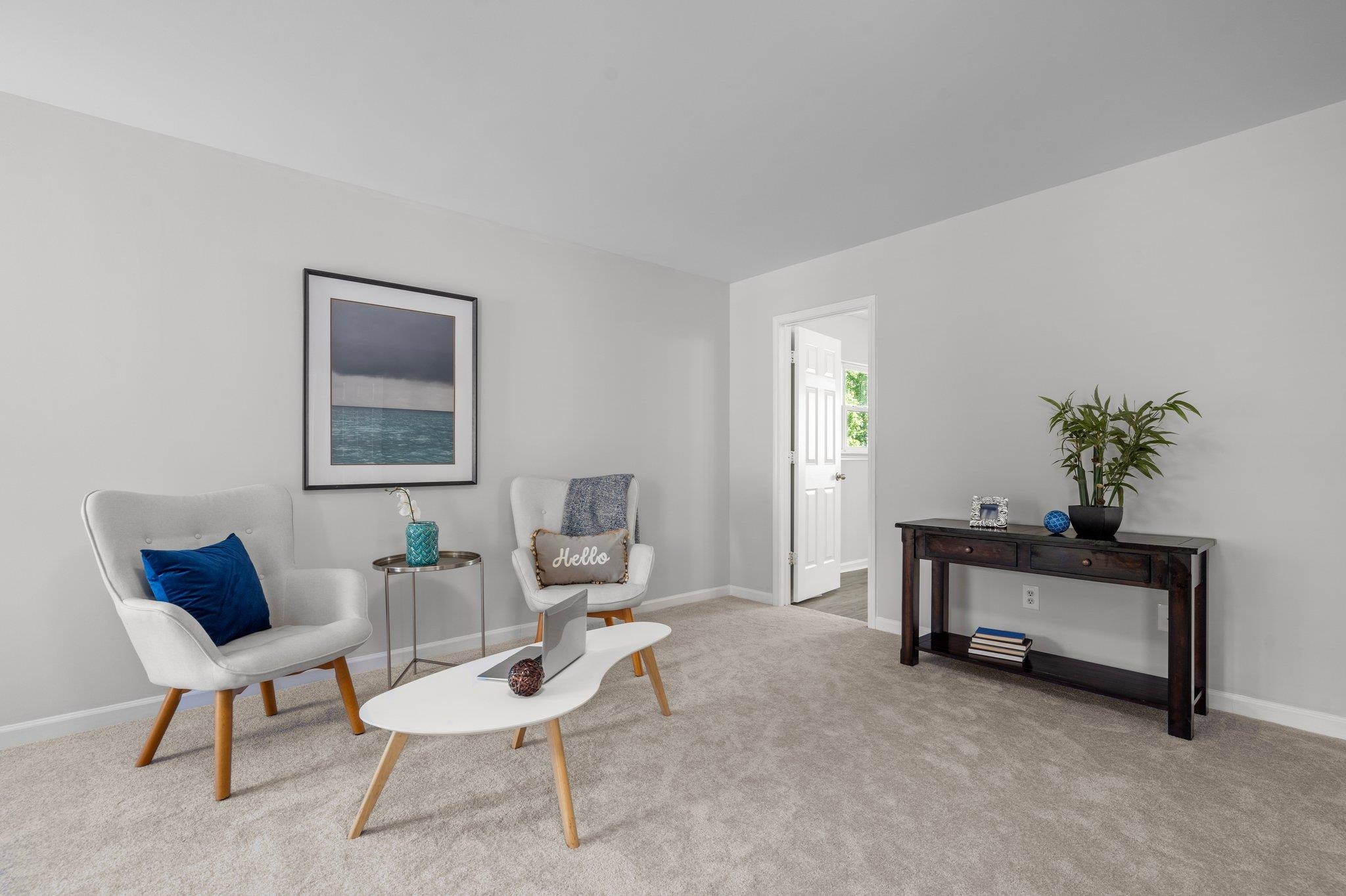 532 Emerald Downs Road Cary, NC 27519 - Photo 30 of 51 a living room with furniture and a potted plant