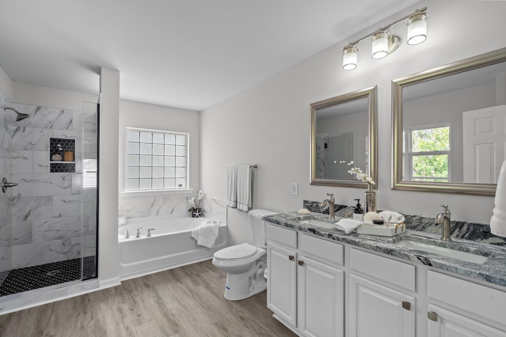 532 Emerald Downs Road Cary, NC 27519 - Photo 32 of 51 a bathroom with a granite countertop toilet sink double vanity and mirror