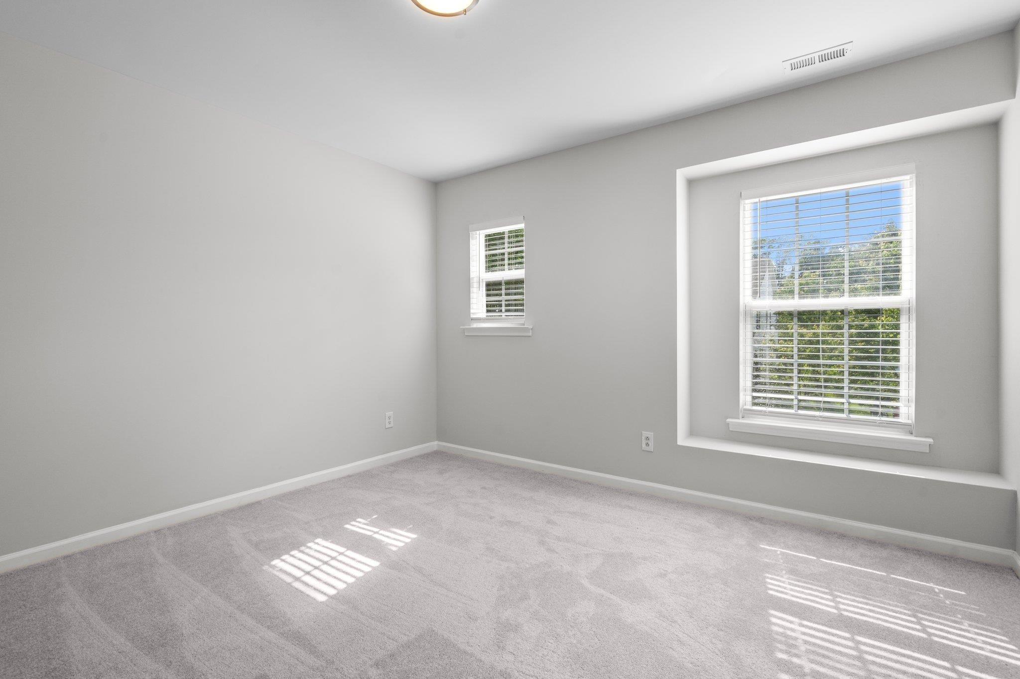 532 Emerald Downs Road Cary, NC 27519 - Photo 40 of 51 a view of an empty room with a window
