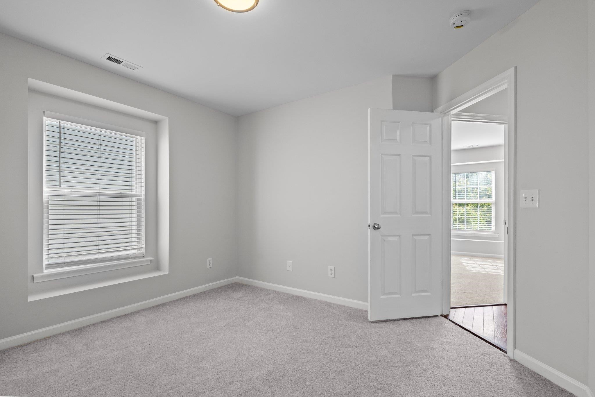 532 Emerald Downs Road Cary, NC 27519 - Photo 43 of 51 a view of an empty room with a window