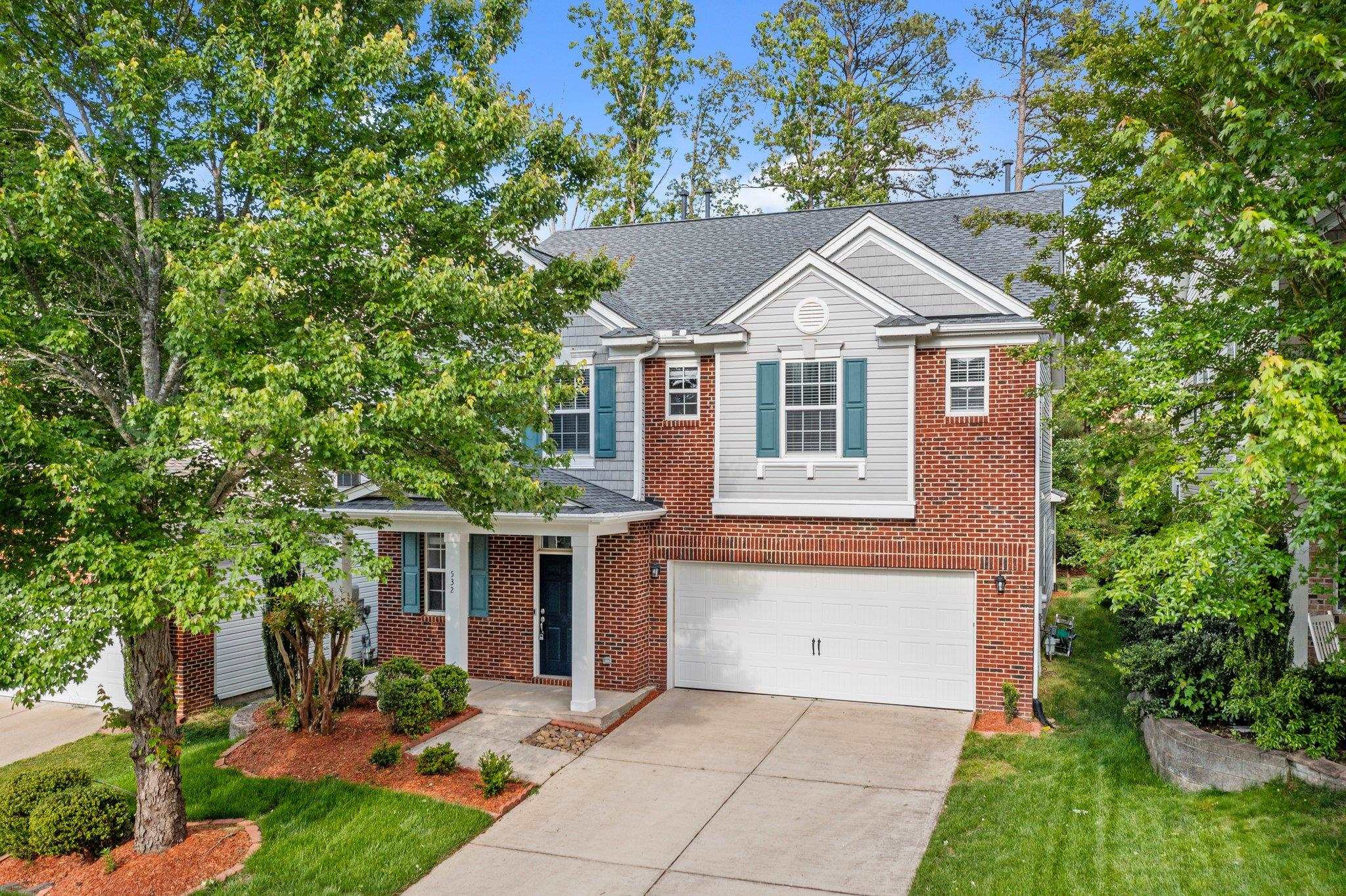 532 Emerald Downs Road Cary, NC 27519 - Photo 9 of 51 a front view of a house with garden