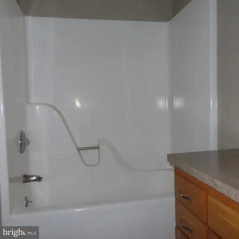 a bathroom with a sink a toilet and a window