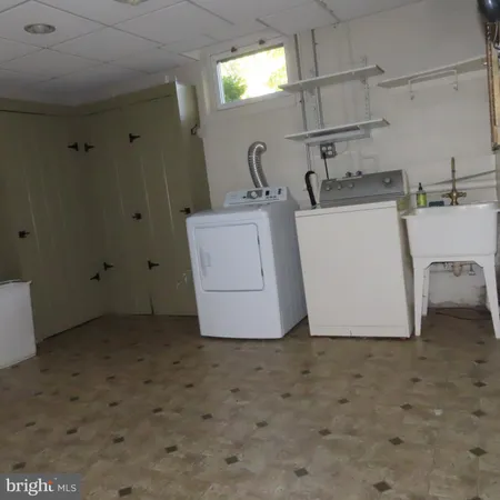 a room with furniture and wooden door