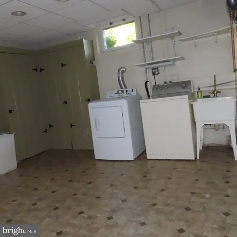 a room with furniture and wooden door