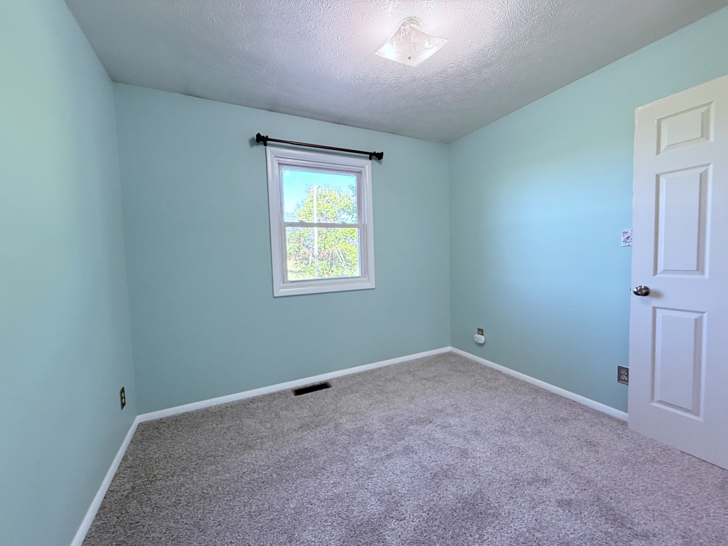 8824 Sunset Road Clinton, IL 61727 - Photo 11 of 24 an empty room with a window