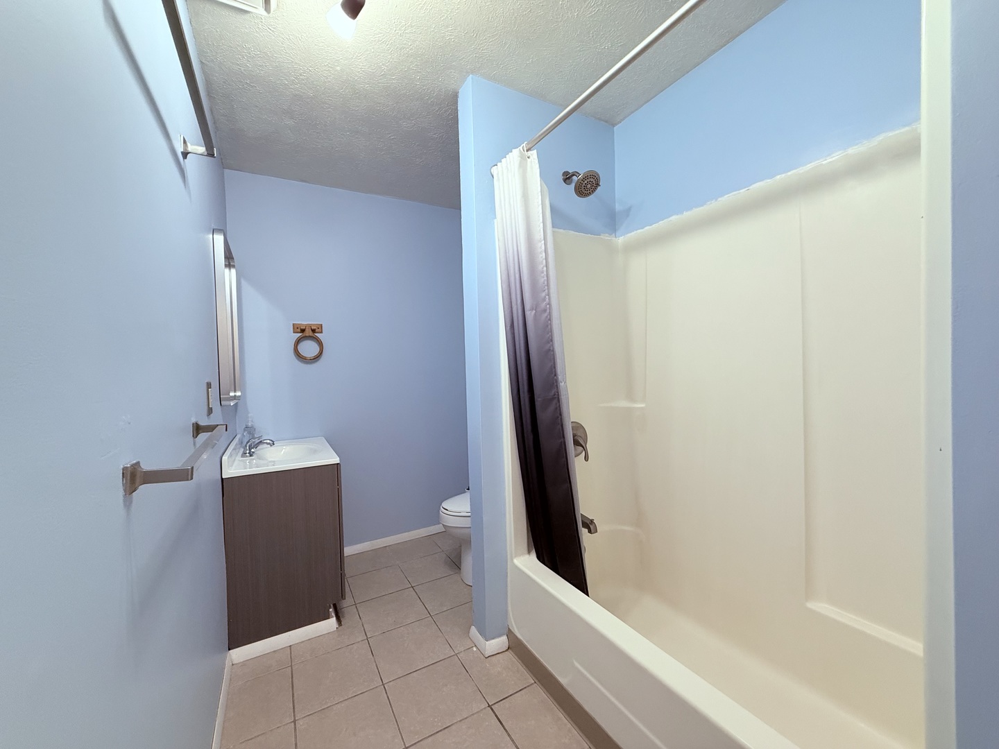8824 Sunset Road Clinton, IL 61727 - Photo 14 of 24 a bathroom with a shower and a sink