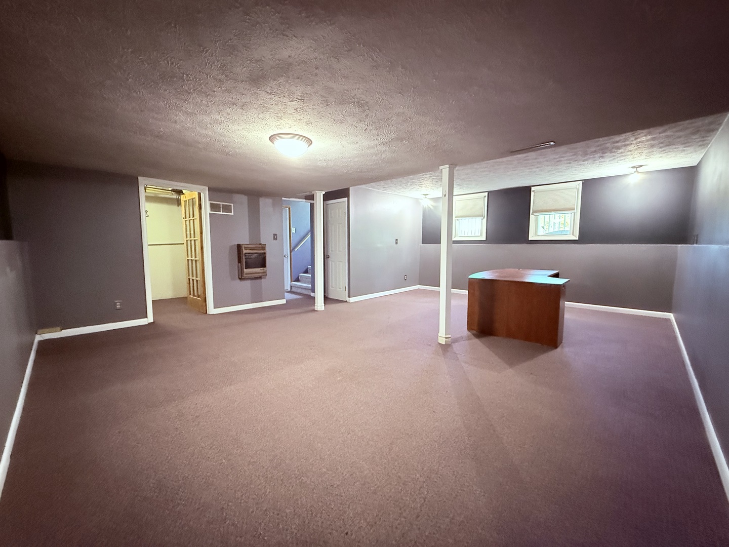 8824 Sunset Road Clinton, IL 61727 - Photo 15 of 24 a view of an empty room with a window and fireplace