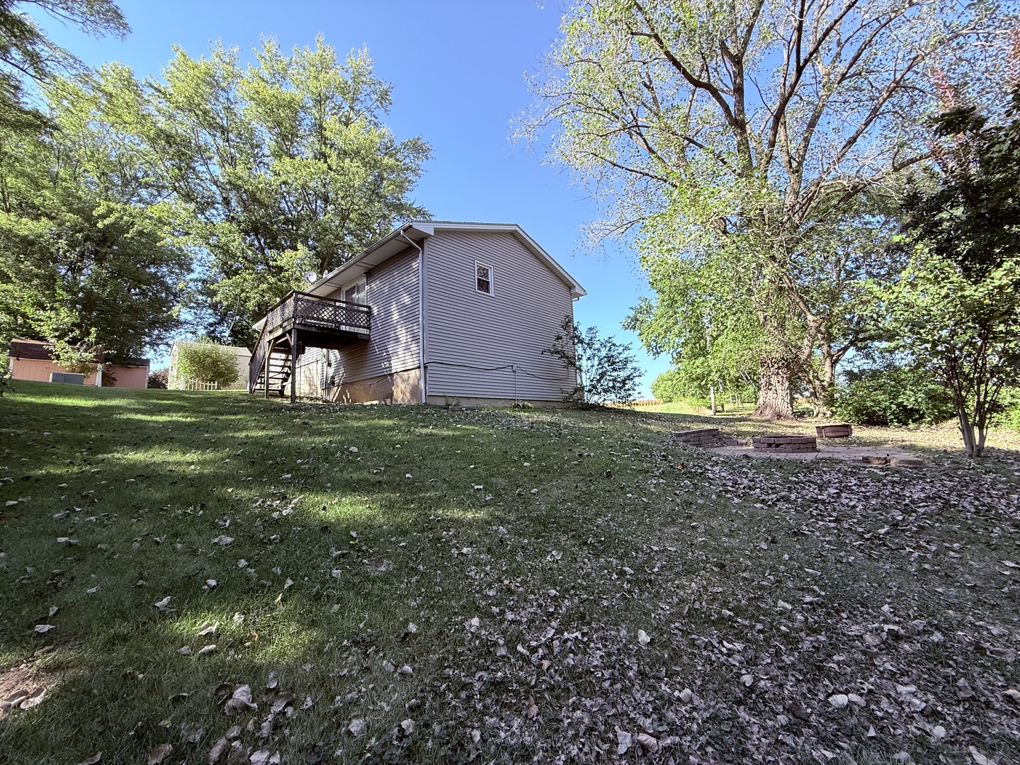 8824 Sunset Road Clinton, IL 61727 - Photo 20 of 24 a view of a house with a yard