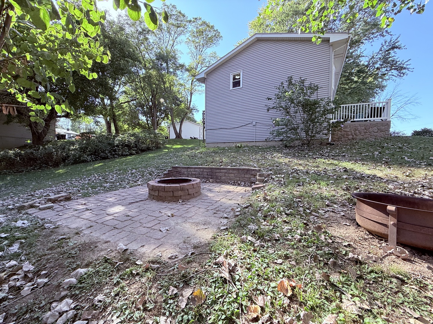 8824 Sunset Road Clinton, IL 61727 - Photo 21 of 24 a view of a backyard with potted plants and large tree