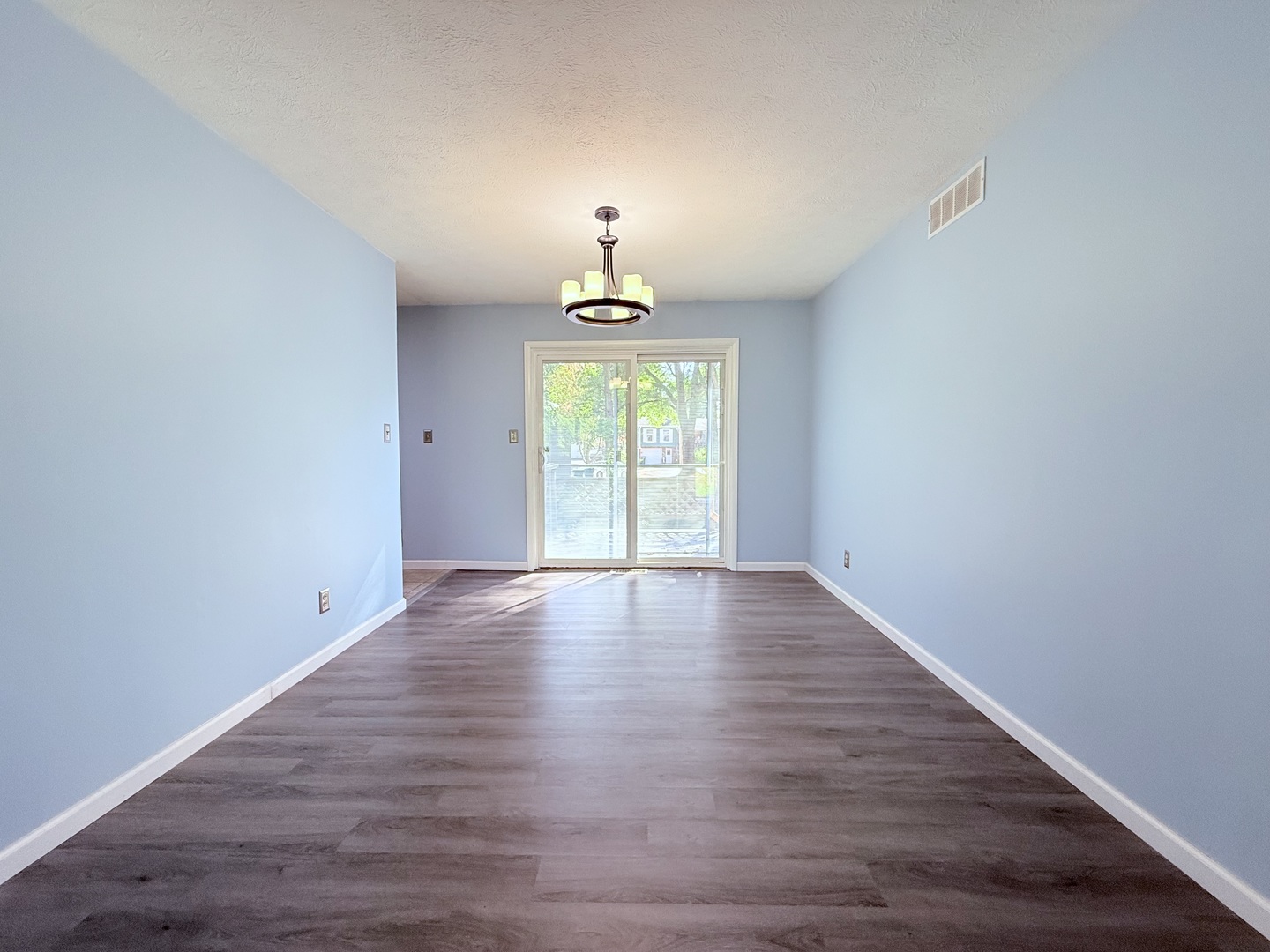8824 Sunset Road Clinton, IL 61727 - Photo 6 of 24 a view of empty room with wooden floor and fan