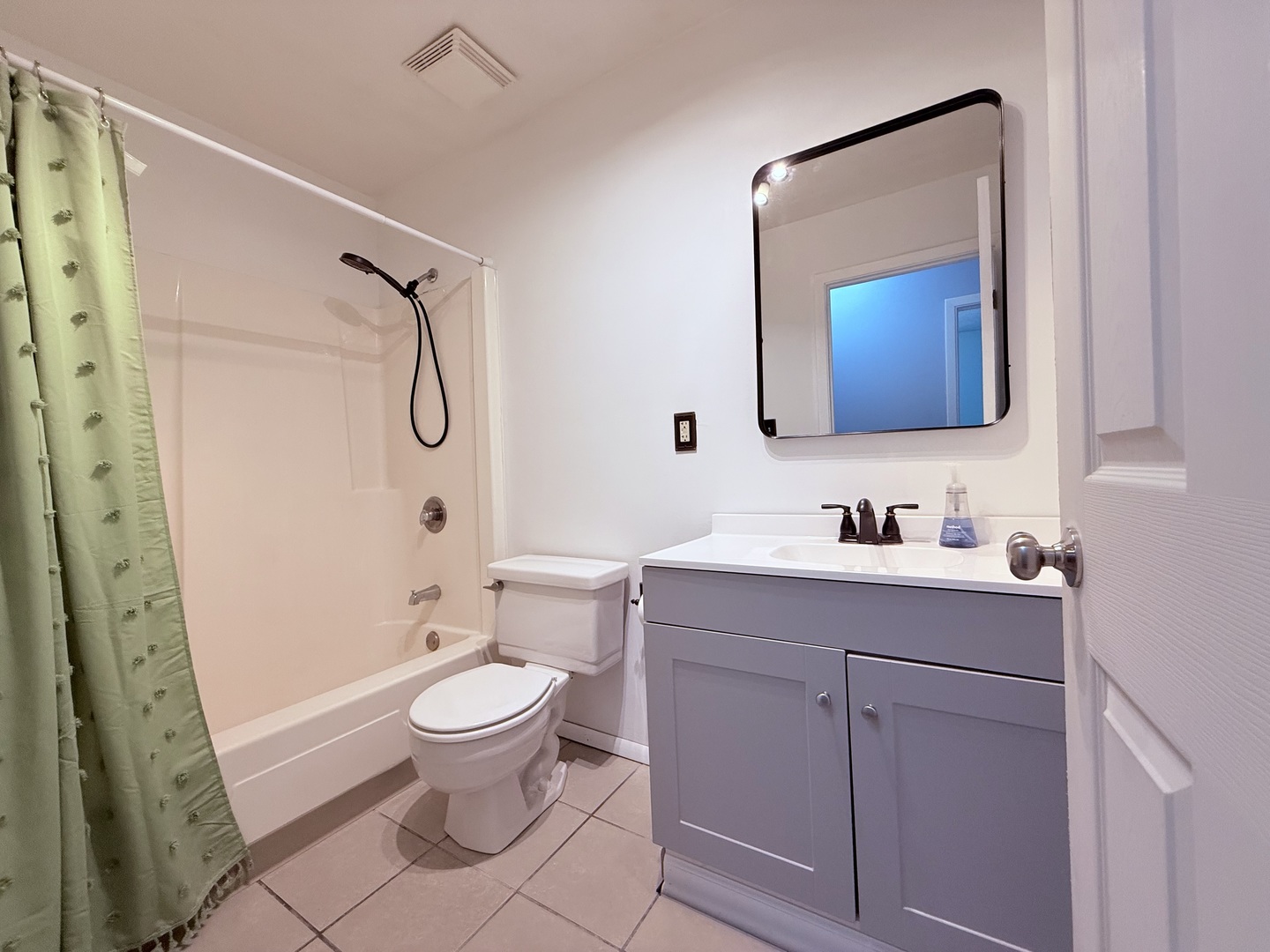 8824 Sunset Road Clinton, IL 61727 - Photo 9 of 24 a bathroom with a sink a toilet and shower