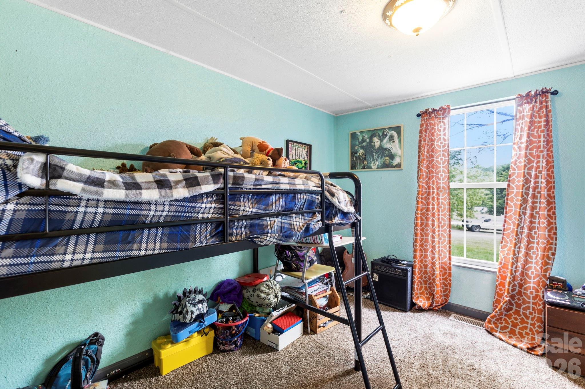 4 Mountain View Road Asheville, NC 28806 - Photo 27 of 35 a bed room with furniture and a window