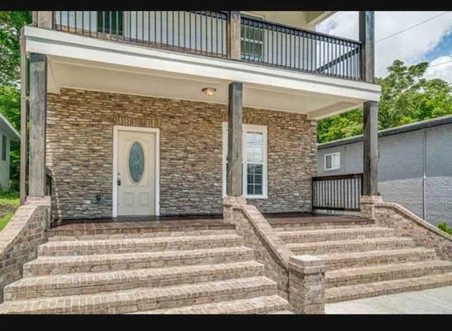 a balcony view with a fireplace