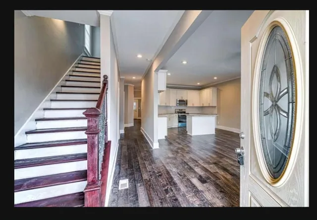 a view of a hallway with washer and dryer