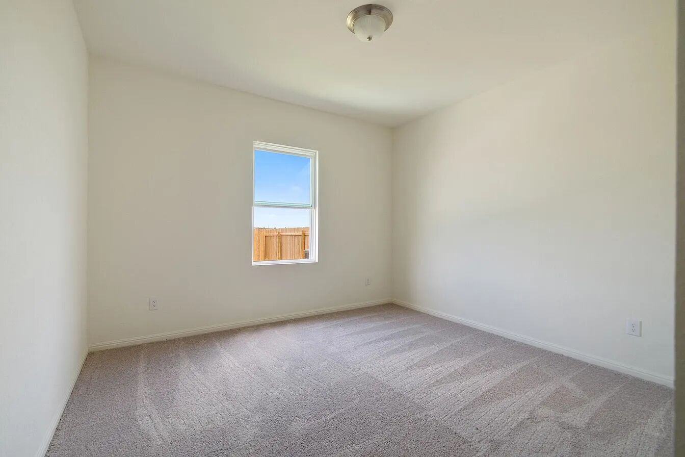 101 Aoudad Road Hutto, TX 78634 - Photo 29 of 39 A well-lit room offers a clean slate, ready for personalization and comfortable living.