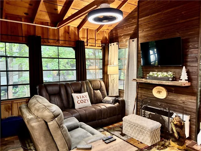 a view of a living room with furniture and a window