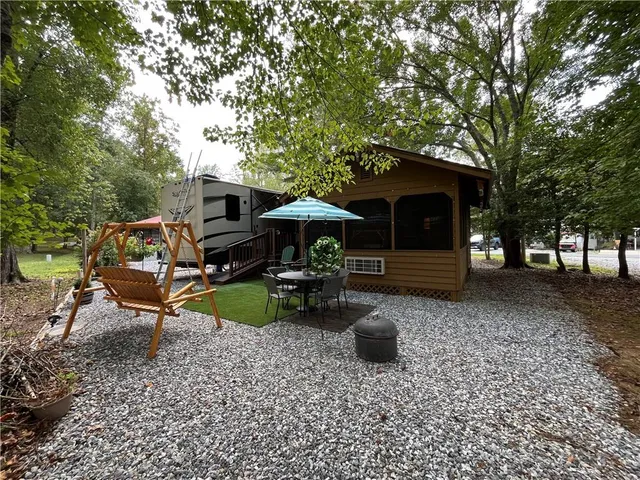 a view of a house with backyard and a slide