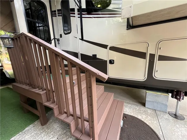 a view of a house with a backyard porch and sitting area