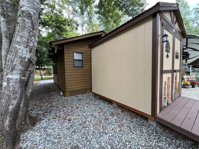 a view of a patio with a table and chairs