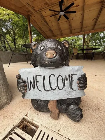 a view of a swimming pool with chairs in patio