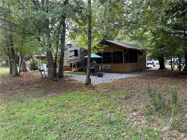 a view of outdoor space with deck and yard