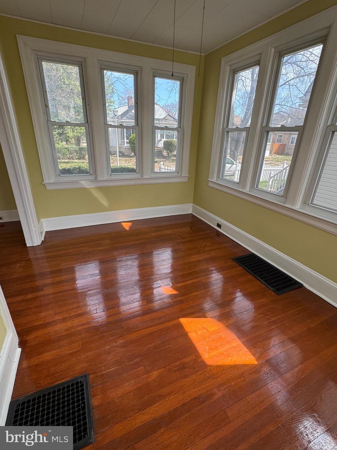50 Broadship Road Dundalk, MD 21222 - Photo 8 of 30 a view of an empty room with wooden floor and a window