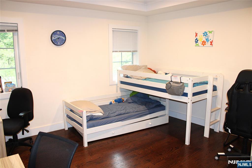294-296 Tenafly Road Tenafly, NJ 07670 - Photo 18 of 24 a bedroom with a bed and a window
