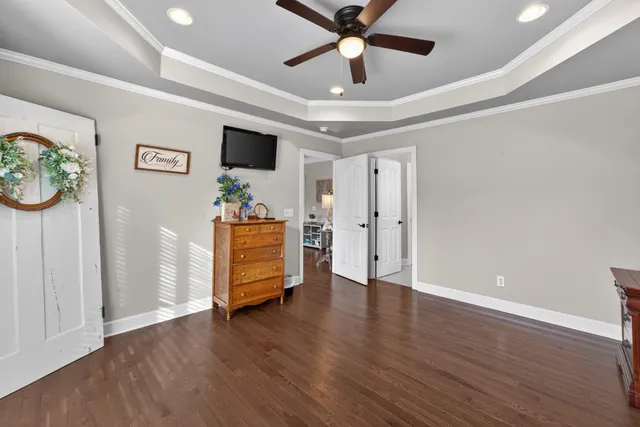 a view of an empty room and wooden floor