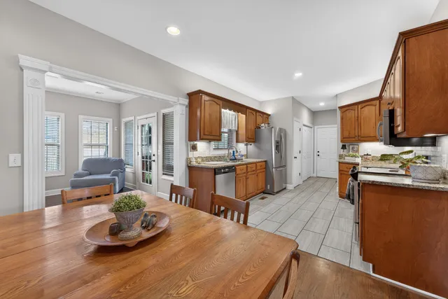 a kitchen with a sink stove and wooden cabinets