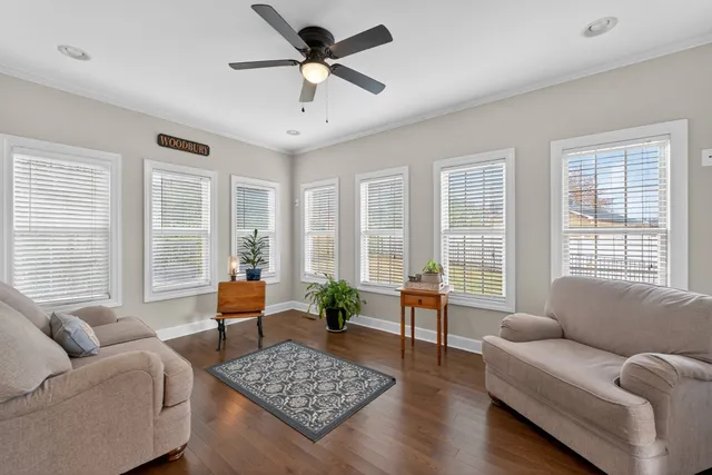a living room with furniture and windows