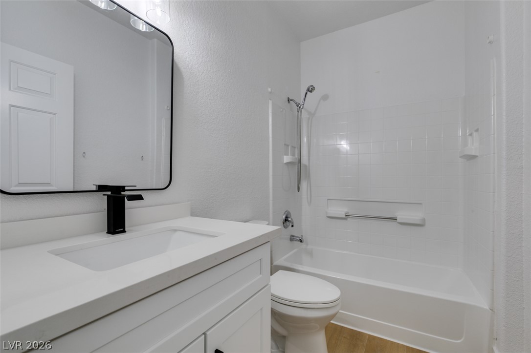 4730 East Craig Road, Unit 1085 Las Vegas, NV 89115 - Photo 12 of 23 A well-lit, contemporary bathroom features sleek fixtures and a pristine shower-tub combination.