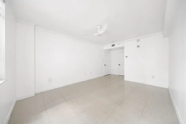 a view of an empty room with a window