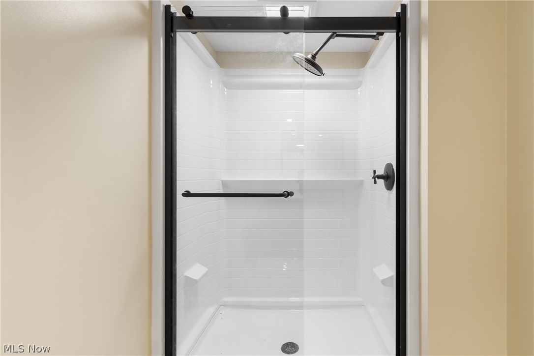 1075 Northeast River Road Lake Milton, OH 44429 - Photo 28 of 34 Enclosed shower with clear glass door and matte black framing