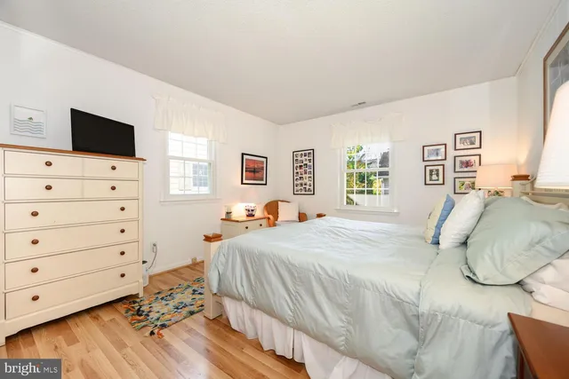 a bedroom with a bed and flat screen tv