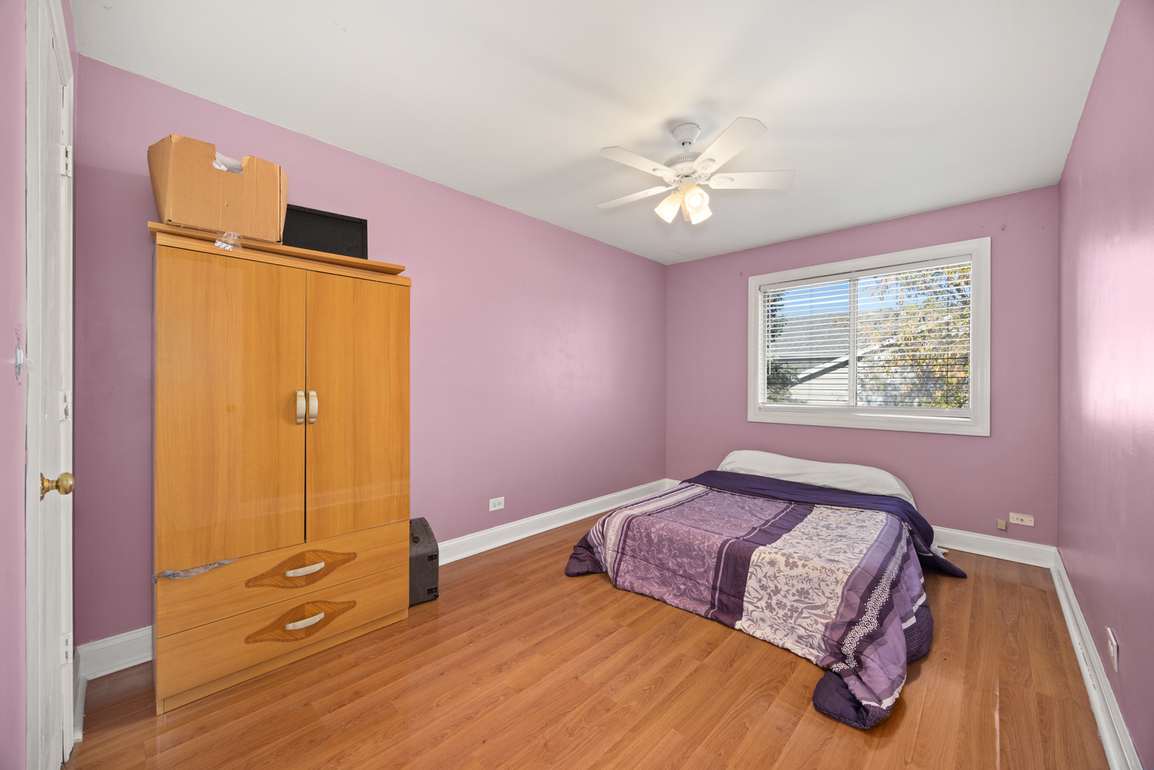 1256 Concord Drive Elgin, IL 60120 - Photo 15 of 22 a bedroom with a bed and a chandelier