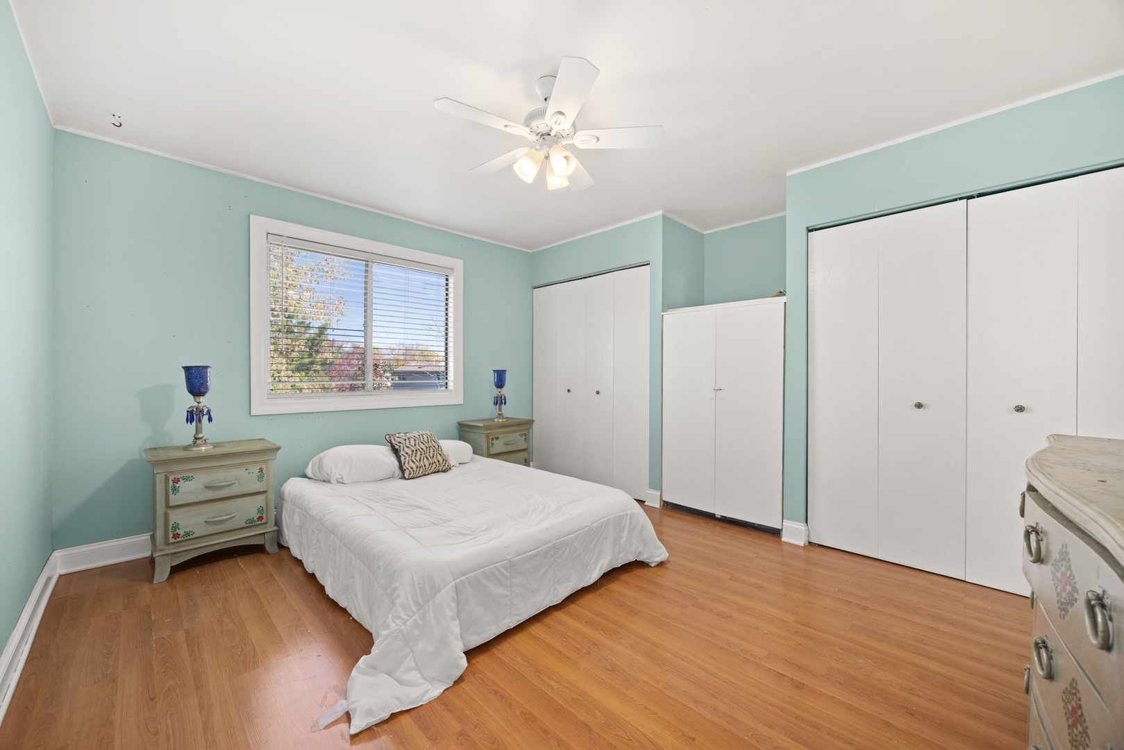 1256 Concord Drive Elgin, IL 60120 - Photo 16 of 22 a bedroom with a bed and a chandelier