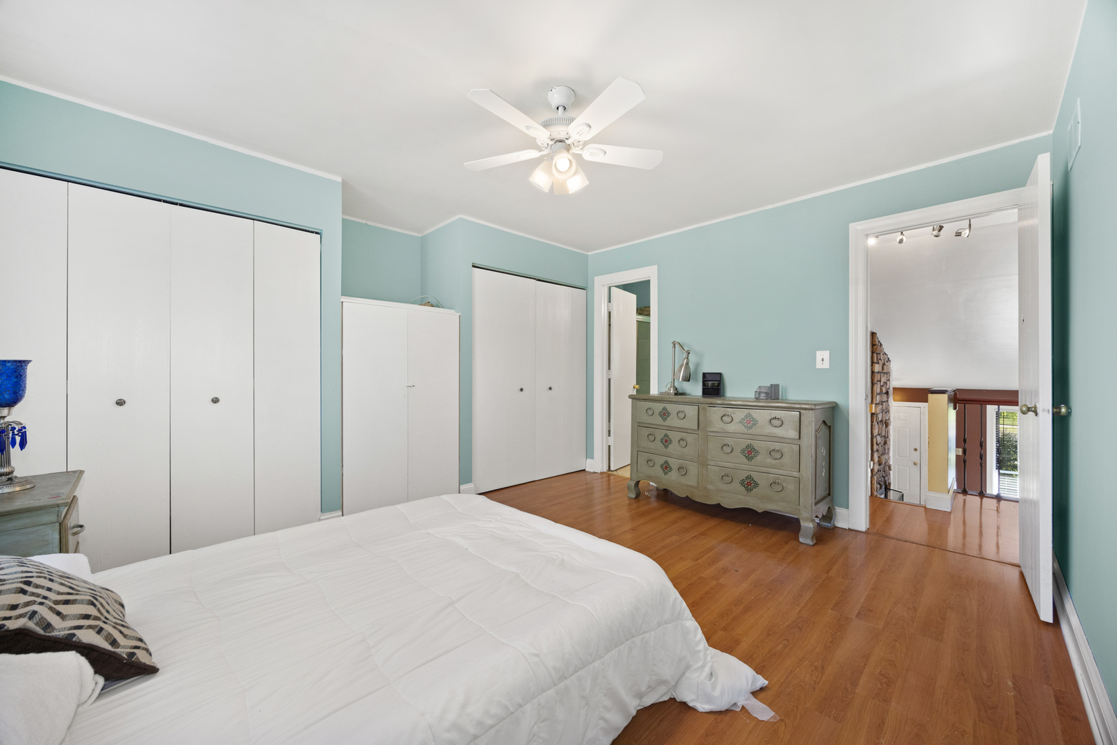 1256 Concord Drive Elgin, IL 60120 - Photo 17 of 22 a bedroom that has a bed and a chandelier