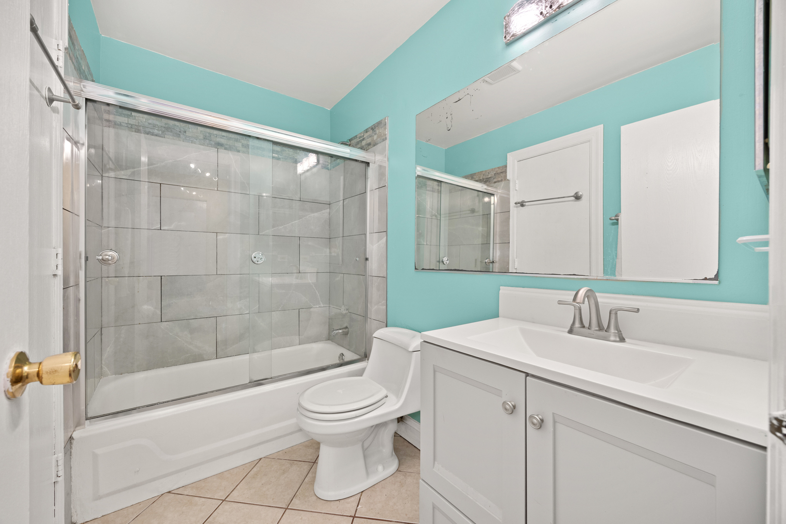 1256 Concord Drive Elgin, IL 60120 - Photo 18 of 22 a bathroom with a sink a toilet and shower